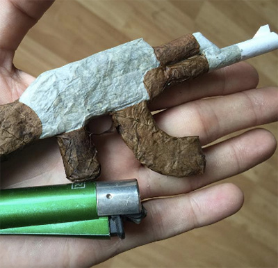 custom cannabis joint in shape of gun
