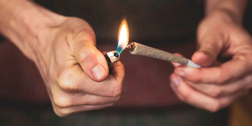 lighting a cannabis pre-roll
