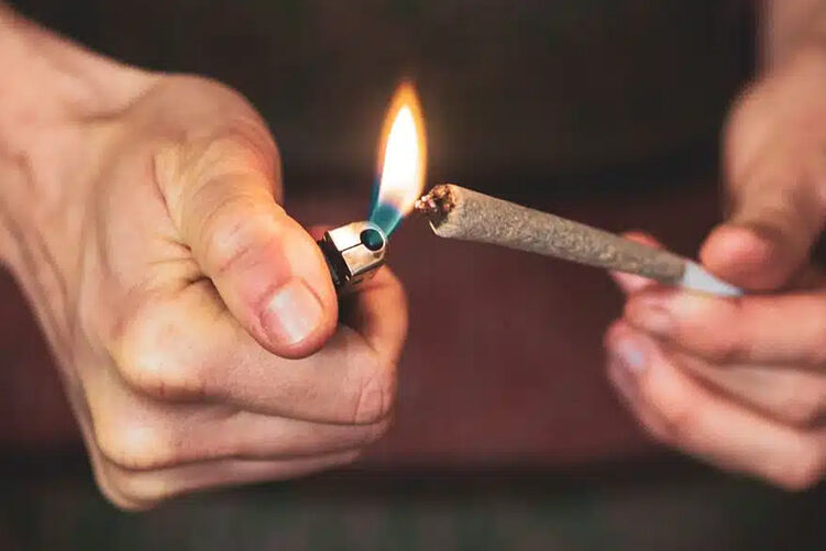 lighting a cannabis pre-roll