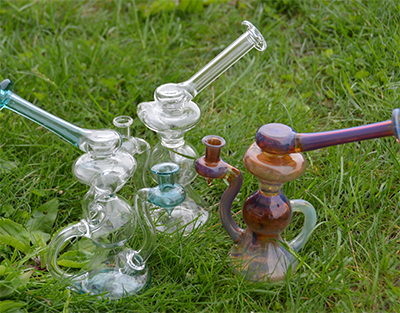 glass weed pipes in the grass