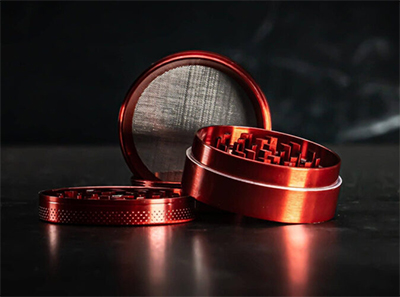 red cannabis grinder